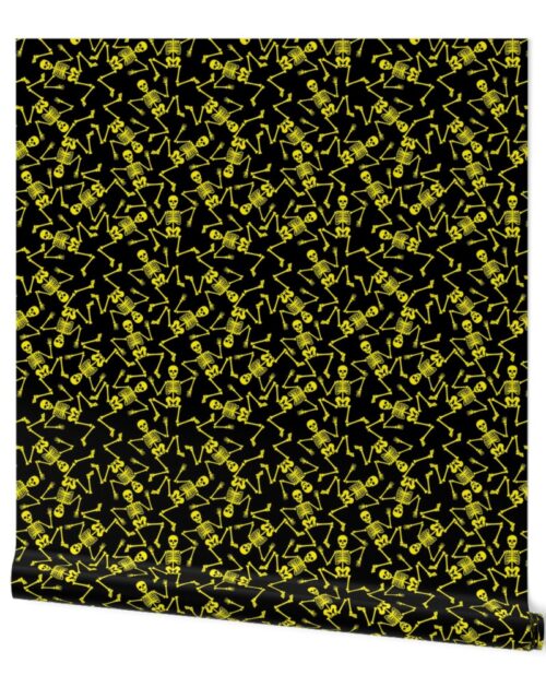 Small Bright Yellow Dancing Halloween Skeletons Scattered On Black Wallpaper
