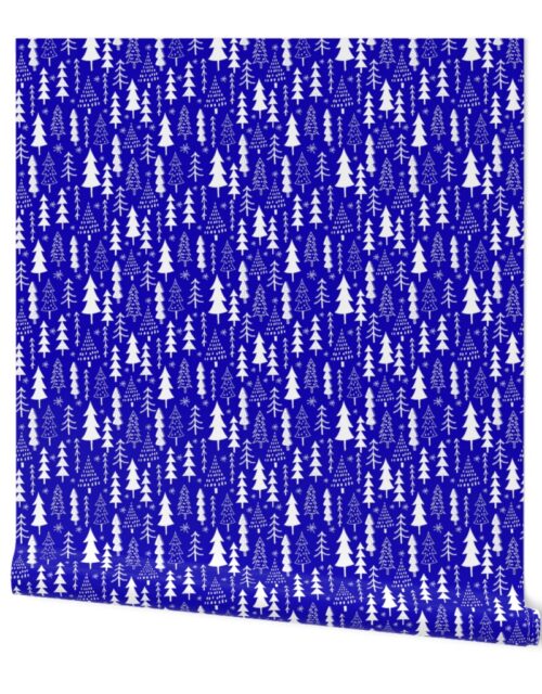 Festive Doodles of White Christmas Trees with Snow  on Royal Blue Wallpaper