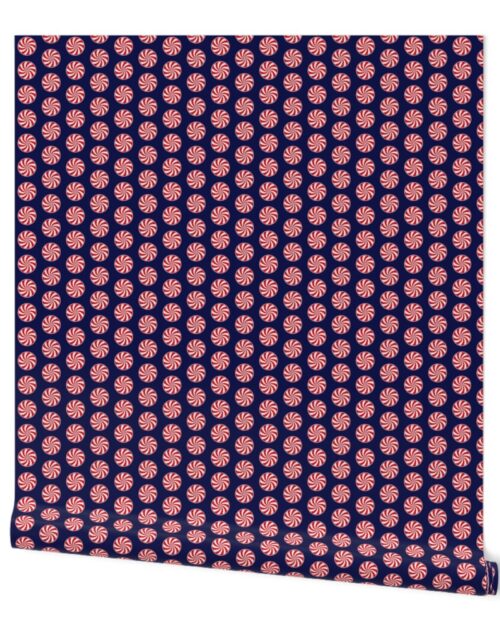 Red and White Peppermint Christmas Candy Swirls on Midnight Blue Wallpaper