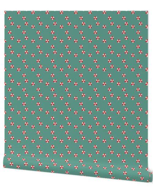 Peppermint Swirls in Red and White Scattered Randomly on on Green Wallpaper