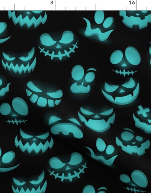 Grinning Halloween Jack o Lantern Faces in Aqua on Black Fabric