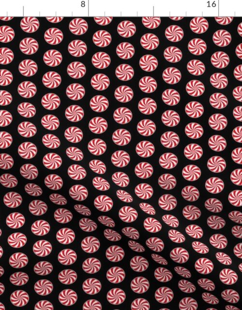 Red and White Peppermint Christmas Candy Swirls on Night Black Fabric