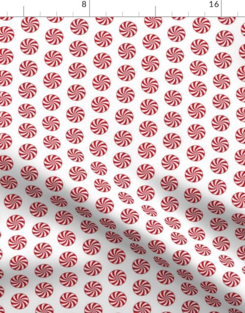 Red and White Peppermint Christmas Candy Swirls on White Fabric