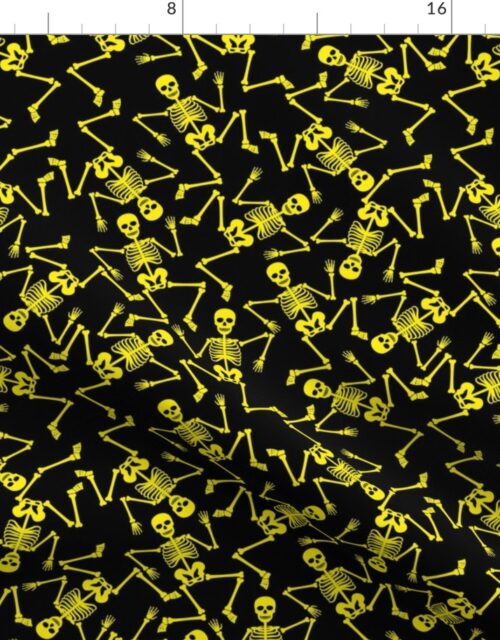 Small Bright Yellow Dancing Halloween Skeletons Scattered On Black Fabric