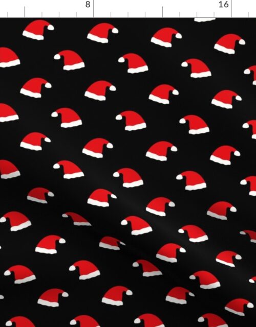Small Jolly Old Saint Nick Red Santa Christmas Hats on Night Black Fabric