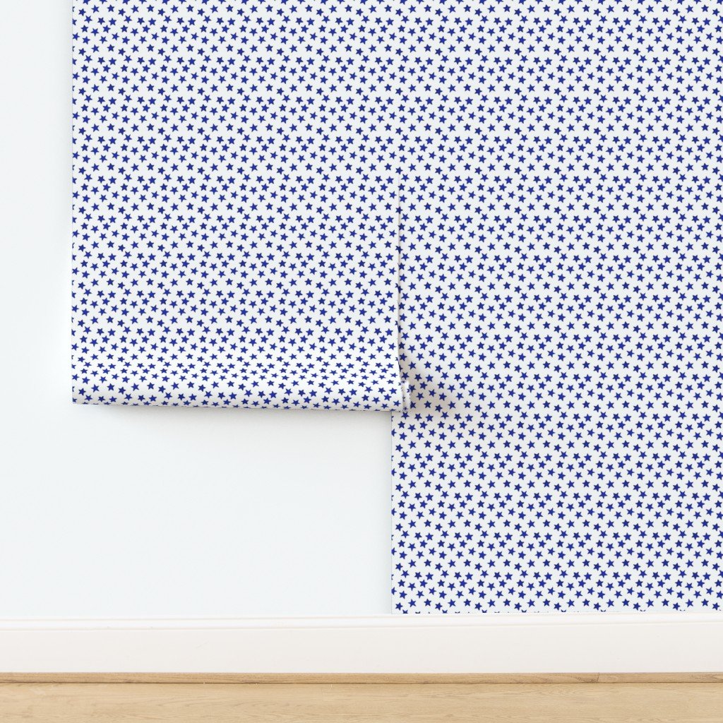 Small Faded Royal Blue Christmas Stars on White Wallpaper design
